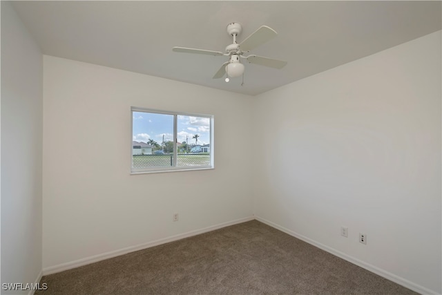 carpeted empty room with ceiling fan