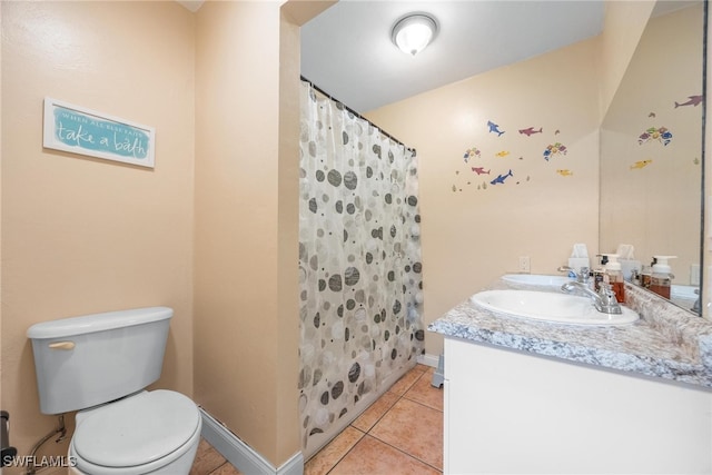 bathroom featuring vanity, toilet, tile patterned floors, and a shower with curtain