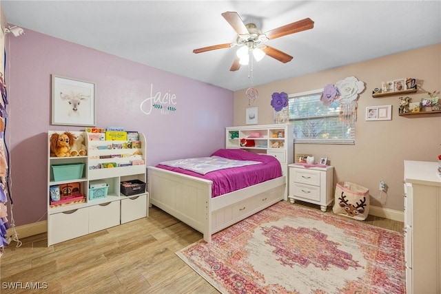 bedroom featuring light hardwood / wood-style floors and ceiling fan