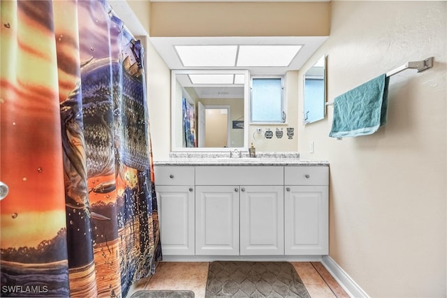 bathroom featuring vanity and tile patterned flooring