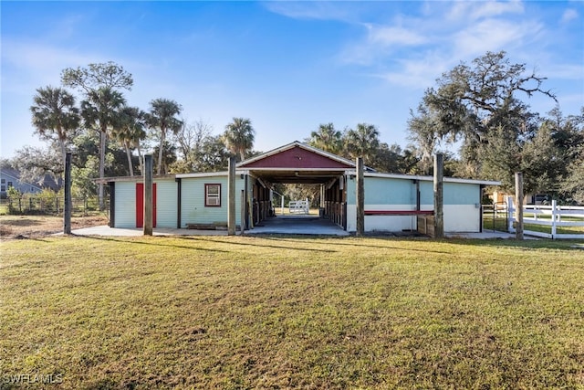 view of front of property with a patio and a front yard