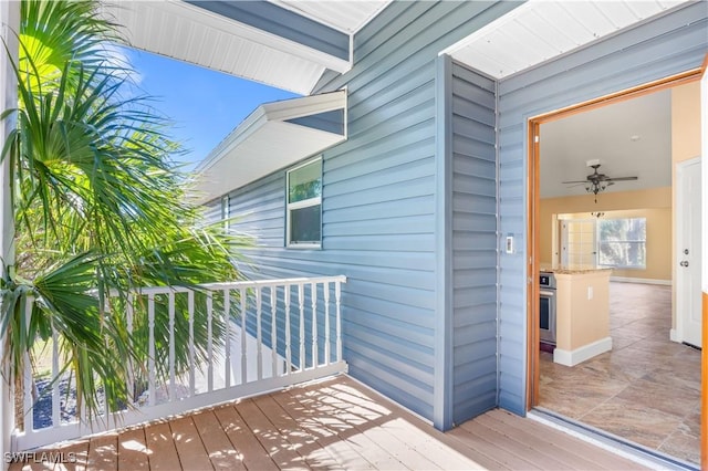 wooden deck with ceiling fan