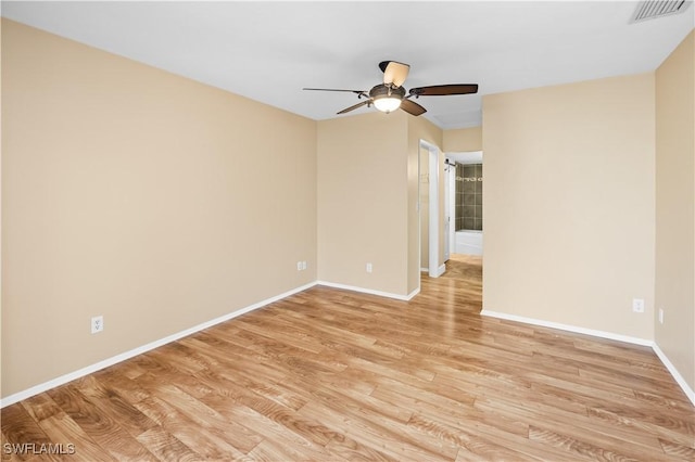 unfurnished room featuring light hardwood / wood-style flooring and ceiling fan