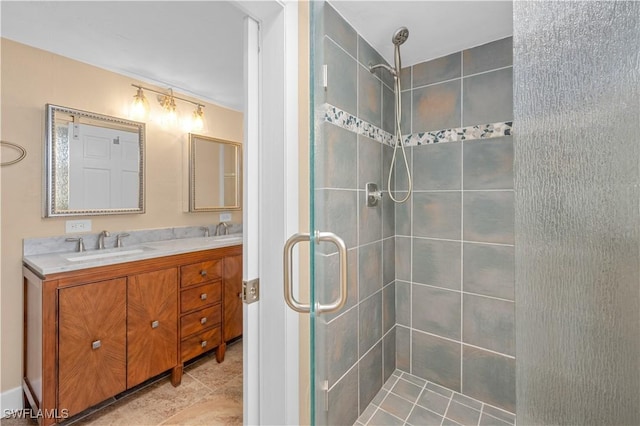 bathroom featuring vanity and a shower with shower door