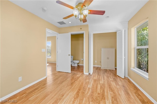 unfurnished bedroom with light hardwood / wood-style flooring and ceiling fan