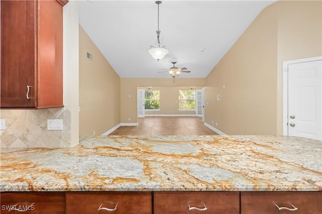 kitchen with backsplash, high vaulted ceiling, kitchen peninsula, and ceiling fan