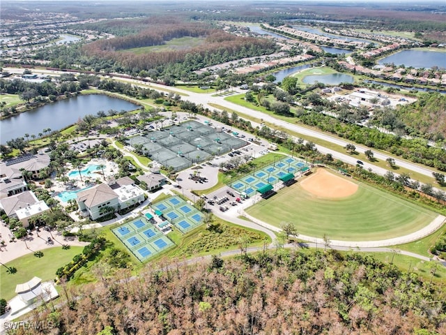 birds eye view of property with a water view