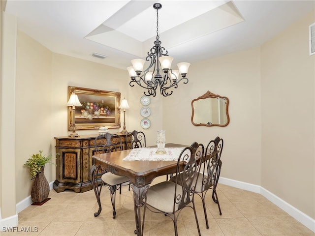 dining space with light tile patterned floors and an inviting chandelier