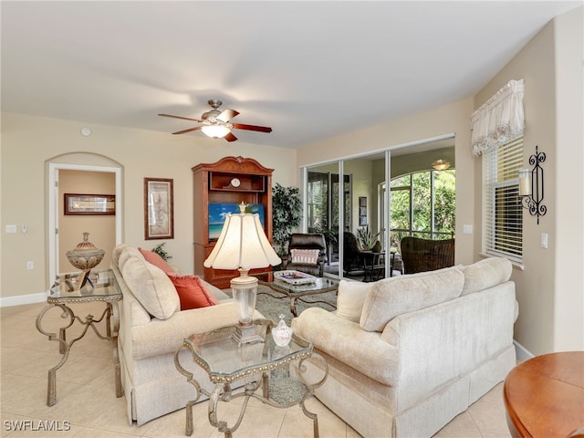 tiled living room with ceiling fan