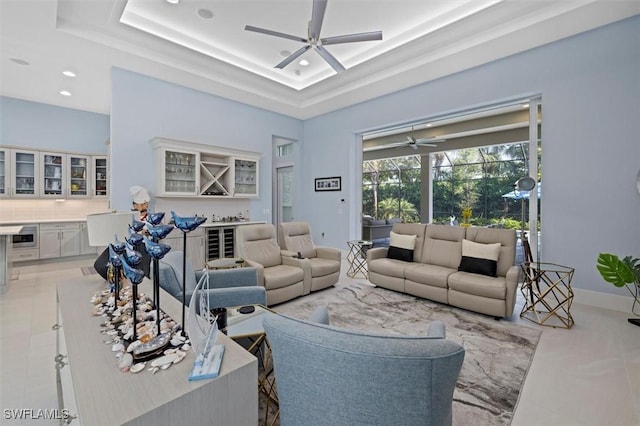 living room featuring a raised ceiling