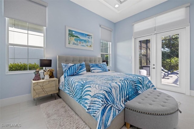 bedroom featuring access to outside, french doors, and tile patterned flooring