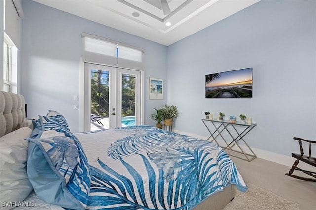 bedroom featuring access to exterior, french doors, and light hardwood / wood-style floors