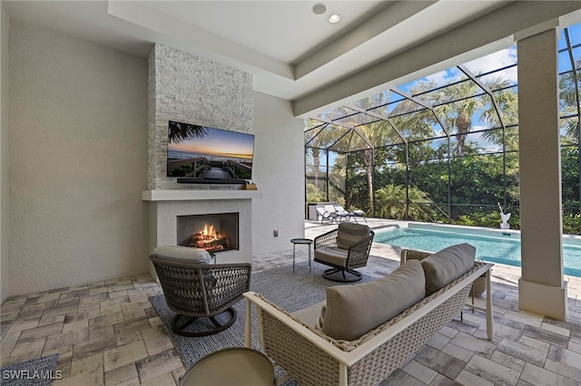 view of patio featuring an outdoor stone fireplace