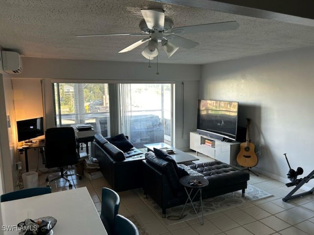 2350 W 1st St Unit 205, Fort Myers, FL 33901 - tiled living room with a wall mounted AC, an office area, a ceiling fan, and a textured ceiling