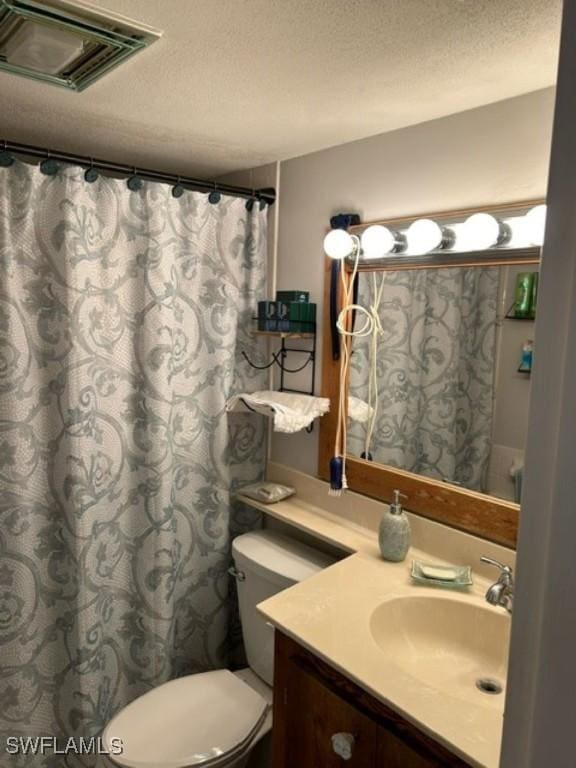 2350 W 1st St Unit 205, Fort Myers, FL 33901 - bathroom with vanity, a textured ceiling, and curtained shower