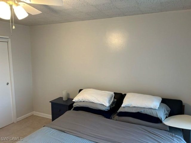 2350 W 1st St Unit 205, Fort Myers, FL 33901 - bedroom featuring light tile patterned flooring and ceiling fan