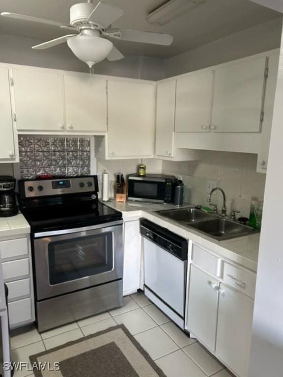 2350 W 1st St Unit 205, Fort Myers, FL 33901 - kitchen featuring stainless steel electric stove, white dishwasher, light countertops, white cabinetry, and ceiling fan