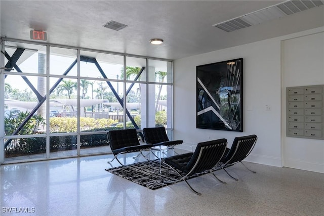 2350 W 1st St Unit 205, Fort Myers, FL 33901 - home office with speckled floor, mail area, and expansive windows