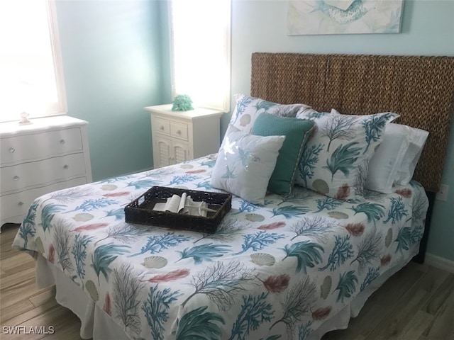 bedroom featuring wood-type flooring