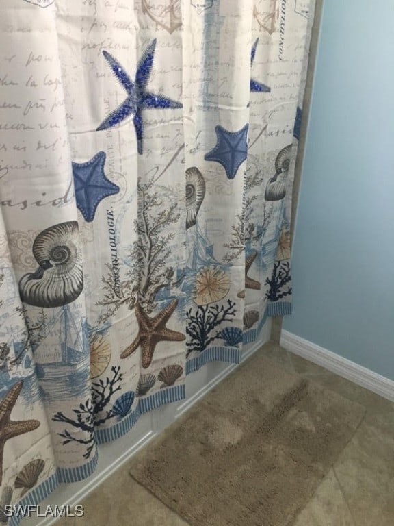 bathroom with curtained shower