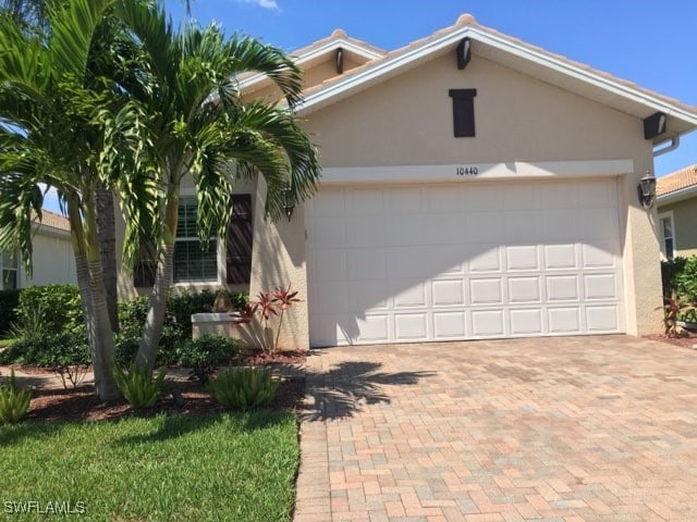 view of front of property with a garage