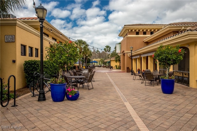 surrounding community featuring a patio area