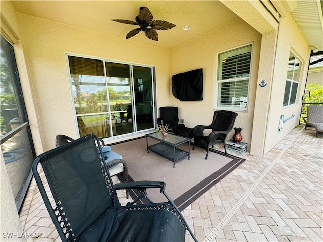 view of patio / terrace featuring ceiling fan and an outdoor hangout area