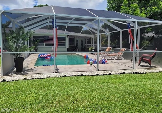 view of pool featuring a patio, glass enclosure, and a lawn