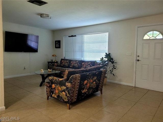 living room featuring light tile patterned floors