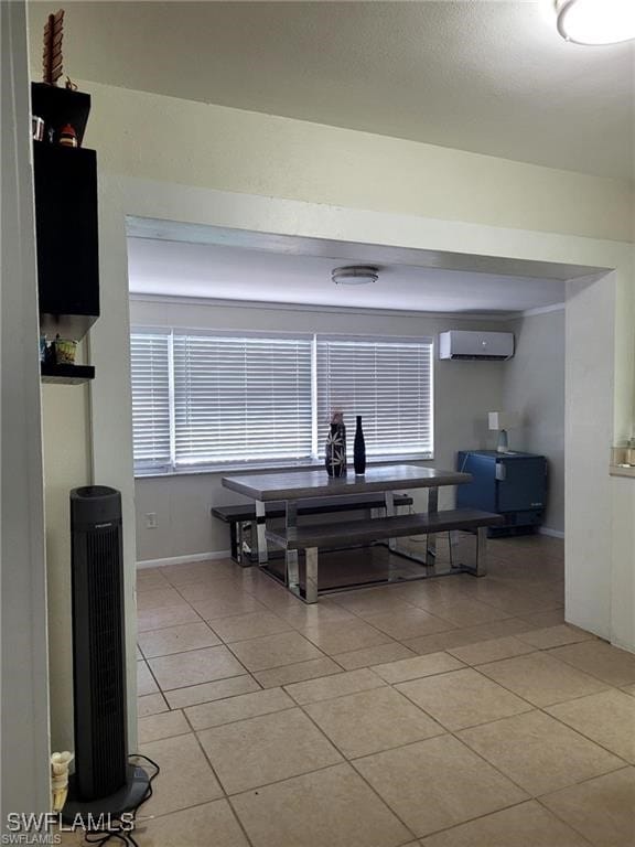 tiled dining space with a wall mounted air conditioner