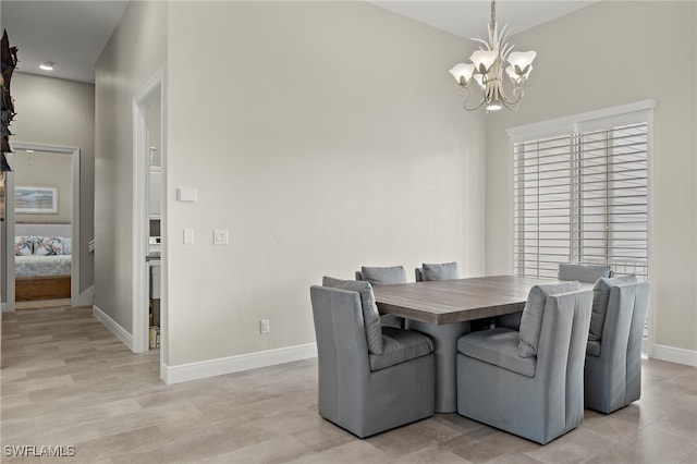 dining room with a chandelier and light hardwood / wood-style flooring