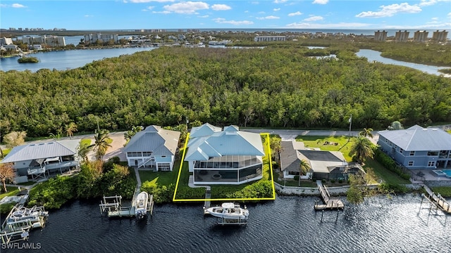 birds eye view of property featuring a water view