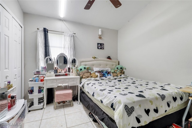 tiled bedroom with a closet and ceiling fan