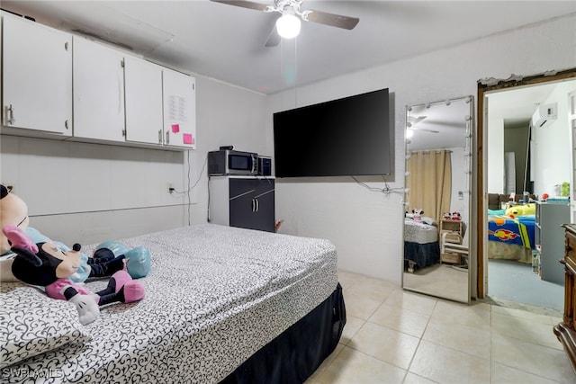 bedroom with ceiling fan and light tile patterned flooring