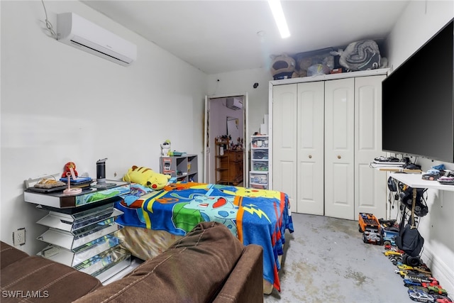 bedroom featuring a closet and an AC wall unit