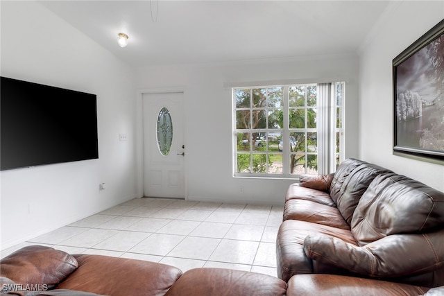 living room featuring ornamental molding and light tile patterned floors