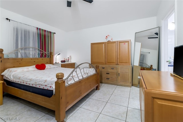 bedroom featuring light tile patterned flooring and ceiling fan