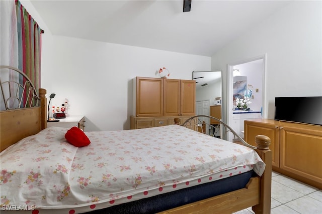 tiled bedroom with vaulted ceiling and ceiling fan