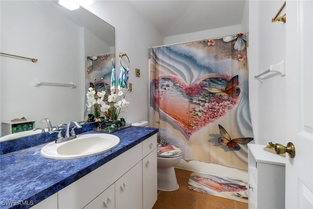 bathroom with vanity, a shower with shower curtain, toilet, and tile patterned flooring