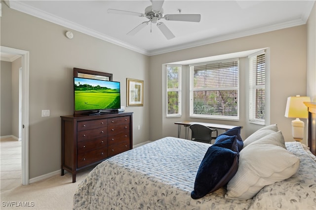 carpeted bedroom with ornamental molding and ceiling fan