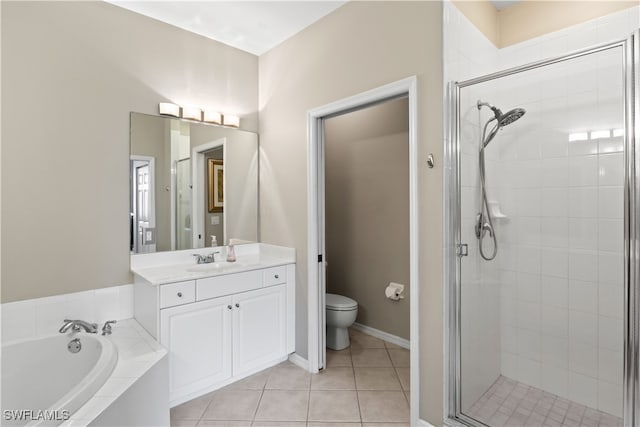 full bathroom featuring vanity, independent shower and bath, toilet, and tile patterned floors