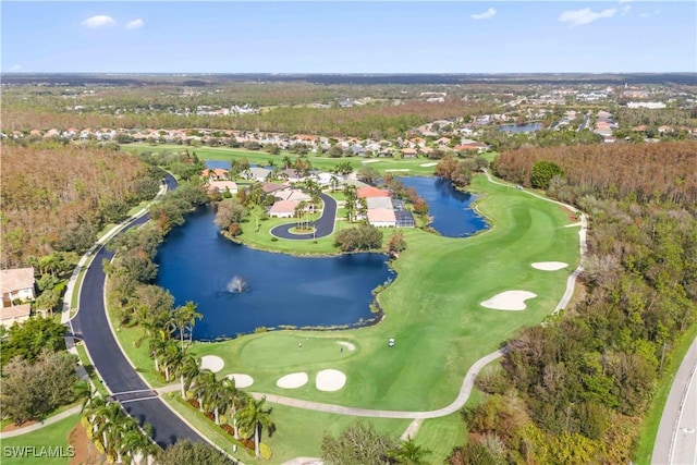 bird's eye view featuring golf course view and a water view