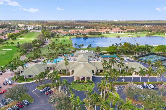 birds eye view of property featuring golf course view and a water view