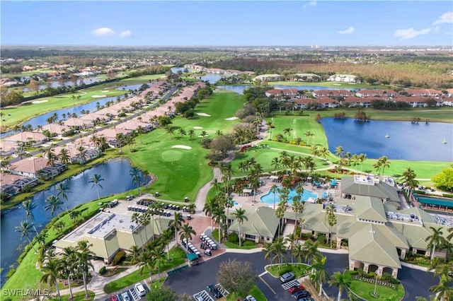 aerial view with a water view and view of golf course