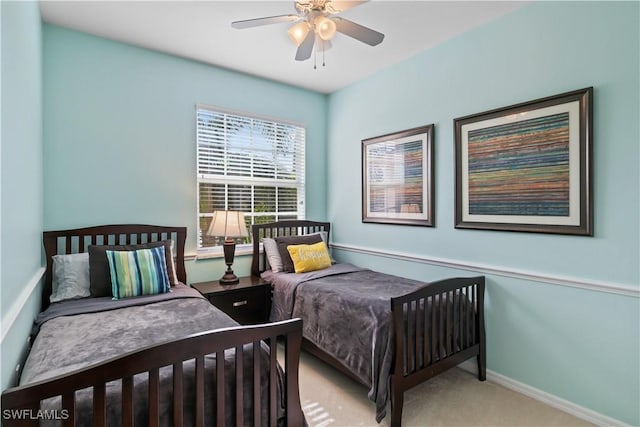 bedroom with baseboards, ceiling fan, and carpet flooring