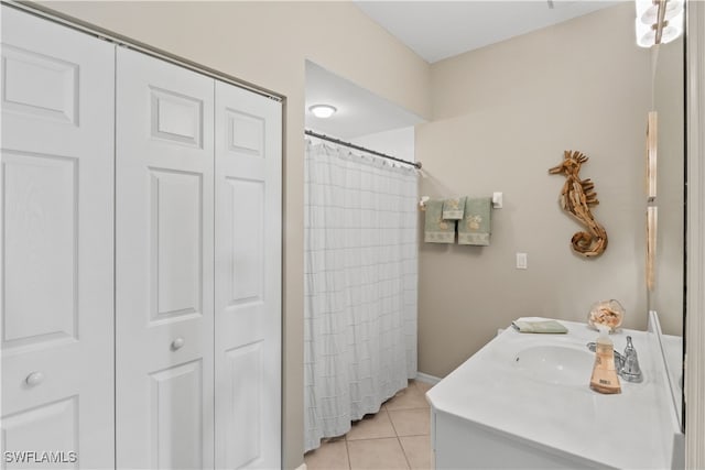 bathroom featuring vanity, curtained shower, and tile patterned flooring