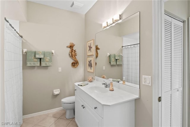 bathroom featuring visible vents, tile patterned floors, toilet, a closet, and vanity