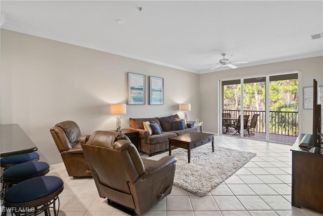 living room with light tile patterned floors, visible vents, ceiling fan, and ornamental molding