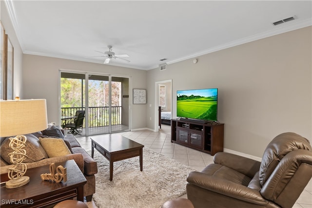 living room with ornamental molding, light tile patterned floors, and ceiling fan