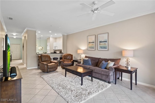 living room with a ceiling fan, baseboards, visible vents, light tile patterned flooring, and crown molding